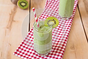 Healthy organic smoothie on the wooden background