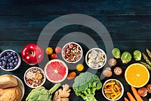 Healthy organic vegetarian food, overhead shot with copy space. Fruit and vegetables, legumes, cheese and other products