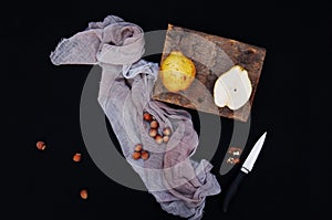 Healthy organic yellow pears on the desk. Fruit background. Ripe fresh organic pears on black background. Pear autumn harvest. Sli