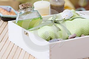 Healthy outfit for relaxation and SPA procedures with towel, stones and body oil