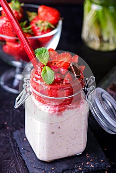 Healthy overnight oats with strawberry in jars