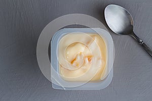 Healthy peach fruit flavored yoghurt with natural coloring in pl