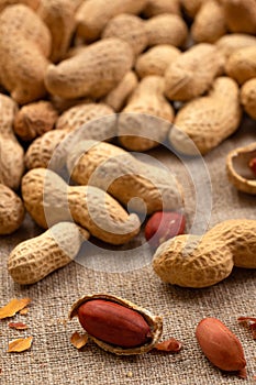 Healthy peanuts, close-up on burlap. Peanut background