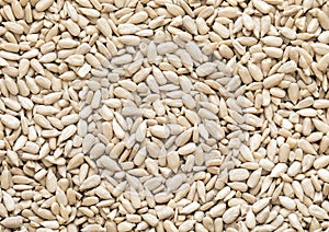 Healthy peeled sunflower seeds top view macro background.Healthy snack