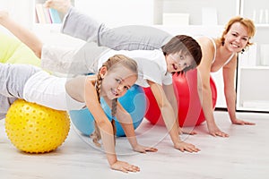 Healthy people doing balancing exercise at home photo