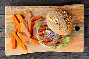 Healthy, plant based burger with sweet potato fries, top view