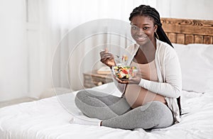 Healthy Pregnancy Nutrition. Happy Pregnant African American Woman Eating Fresh Vegetable Salad