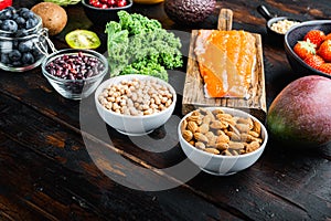 Healthy products immunity boosters  on dark wooden background, with space for text