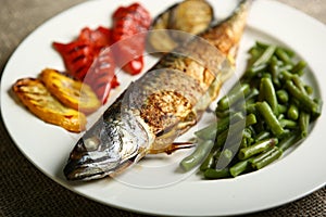 Healthy and proper food, grilled fish and vegetables