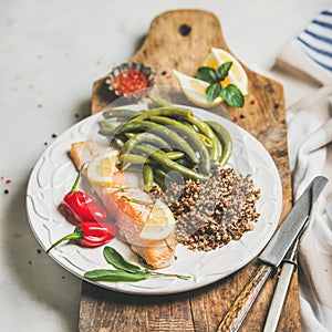 Healthy protein rich dinner plate with roasted salmon and quinoa