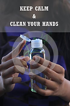 Healthy quote - Keep calm and clean your hands. With hands holding hand sanitizer liquid alcohol to prevent epidemic corona virus.