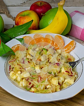 Healthy rasped fruit salad with apples
