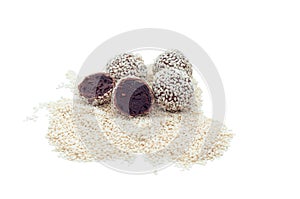 Healthy raw energy balls with cocoa, chocolate, flaxseed, on a white background. Vegan Chocolate Truffles.