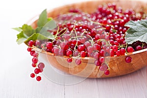 Healthy red currants in a bowl with extras