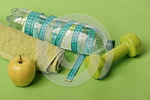 Healthy regime equipment, copy space. Barbell by juicy green apple