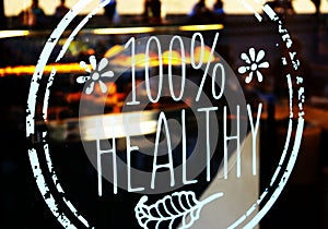 100 % healthy restaurant window decal. Sticker on door glass photo