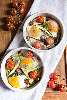 Healthy and rich breakfast with baked eggs and vegetables