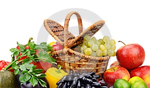 Healthy ripe fresh vegetables and fruits in basket isolated on white