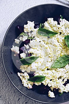 Healthy salad with beet root, cottage cheese and basil