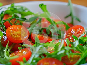 Healthy salad with cherry tomatoes and rucola, close-up
