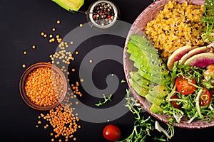 Healthy salad with chicken, tomatoes, avocado, lettuce, watermelon radish and lentil