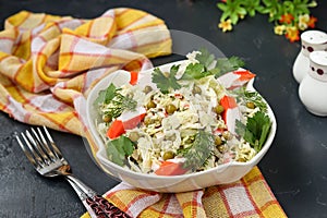 Healthy salad with Chinese cabbage, canned peas and crab sticks