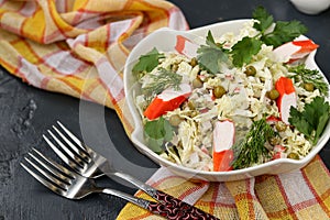 Healthy salad with Chinese cabbage, canned peas and crab sticks