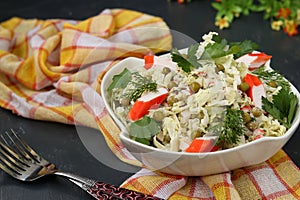 Healthy salad with Chinese cabbage, canned peas and crab sticks