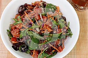 Healthy Salad of Mixed Vegetables, Fruit and Seeds in a Bowl