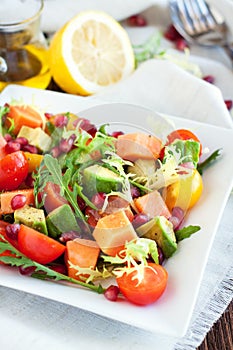 Healthy salad with papaya, avocado, tomatoes