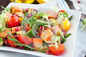 Healthy salad with papaya, avocado, tomatoes