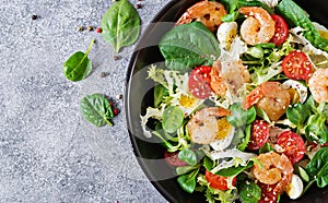 Healthy salad plate. Fresh seafood recipe. Grilled shrimps and fresh vegetable salad and egg. Grilled prawns. Healthy food. Flat l