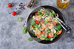 Healthy salad plate. Fresh seafood recipe. Grilled shrimps and fresh vegetable salad and egg. Grilled prawns. Healthy food. Flat l