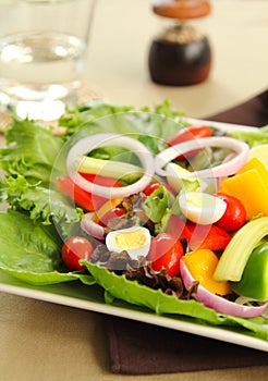 Healthy salad with quail eggs photo