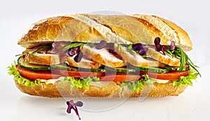 Healthy salad roll baguette with sliced chicken breast isolated on white background