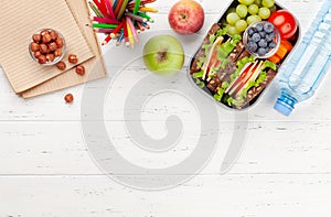 Healthy school lunch box with sandwich and fresh vegetables