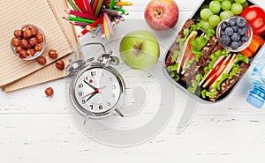 Healthy school lunch box with sandwich and fresh vegetables