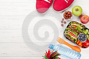 Healthy school lunch box with sandwich and fresh vegetables