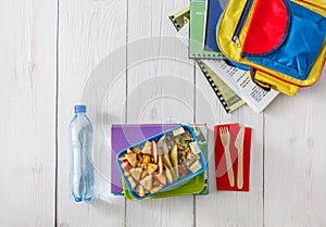Healthy school lunch box on white wood background, top view
