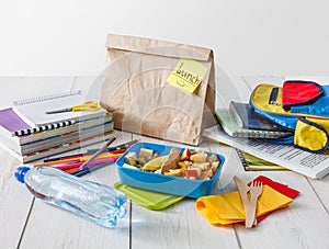 Healthy school lunch in box on white wood table background