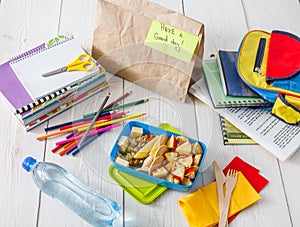 Healthy school lunch in box on white wood table background