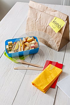 Healthy school lunch in box on white wood table background