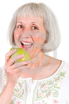 Healthy Senior Lady Eating Green Pear