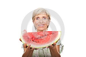 Healthy senior woman holding watermelon