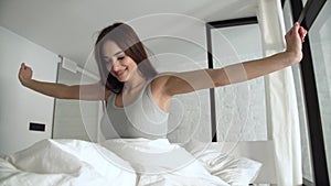 Healthy Sleep. Happy Woman Waking Up In Bed With White Bedding