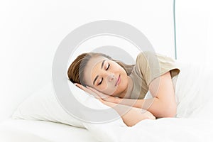 Healthy sleeping. Peaceful sleep of the carefree woman lying on white linen