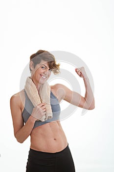 Healthy slim woman showing muscles.