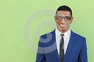 Healthy Smile. Teeth Whitening. Beautiful Smiling Young African man Portrait close up. Over modern corridor background . Laughing