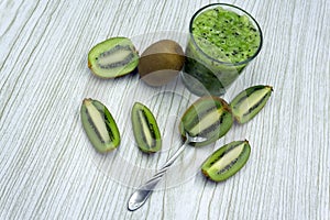 Healthy smoothie with kiwi, green grape, and banana in glass jar, horizontal .