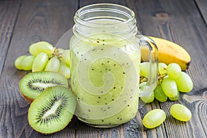 Healthy smoothie with kiwi, green grape, and banana in jar